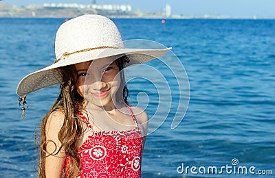 Cute little girl in hat relaxing on the sea, summer, vacation, t Stock Photo