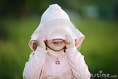 Cute little girl hood in summer park Stock Photo