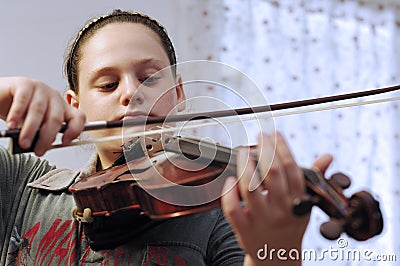Cute little girl learn viola lesson Stock Photo