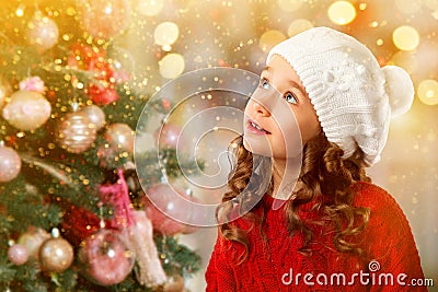 Cute little girl near Christmas tree. New Year card Stock Photo