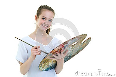 Little girl with palette and brush learning to draw. Stock Photo