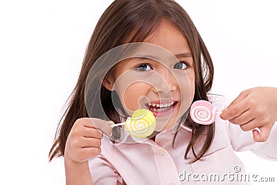 Cute little girl playing, eating sugar jelly sweet candy Stock Photo