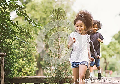 Cute little girl playing outdoor. kid and friend happy play at park. Stock Photo