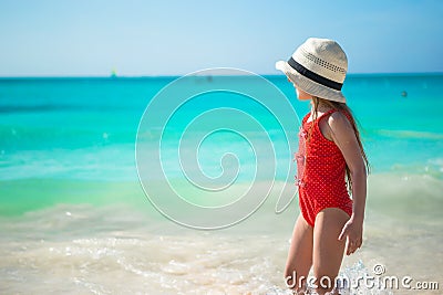 Cute little girl playing in shallow water at Stock Photo