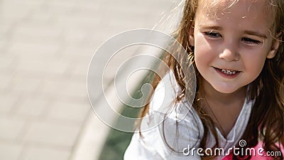 cute little girl plays outdoors on the summer , and walks around the park, happy childhood Stock Photo