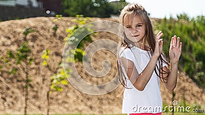 cute little girl plays outdoors on the summer , and walks around the park, happy childhood Stock Photo