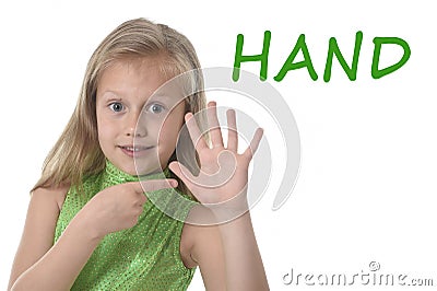 Cute little girl pointing her hand in body parts learning English words at school Stock Photo