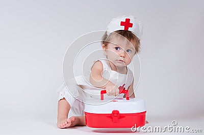 Cute little girl pretending to be a doctor Editorial Stock Photo