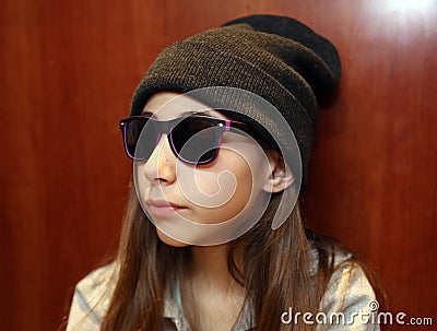 Cute little girl smiling wearing white and black sunglasses Stock Photo