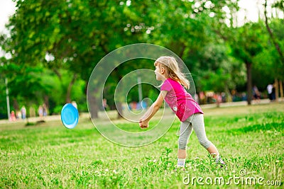 Cute little girl in white bows hold telephone and take picture on red backgroundLittle girl play with flying disk in motion Stock Photo