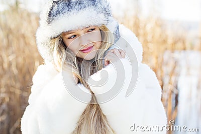 Cute little girl in winter clothes outdoors Stock Photo