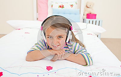 Cute little gril listening to music Stock Photo