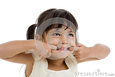 Cute little kid making a grimace Stock Photo