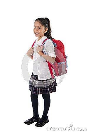 Cute little latin school girl carrying schoolbag backpack and books smiling Stock Photo