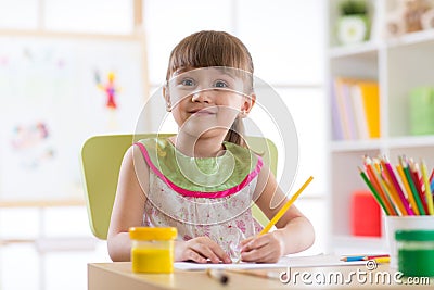 Cute little preschooler child drawing at home Stock Photo