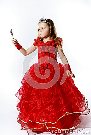 Cute little princess dressed in red isolated on white background Stock Photo