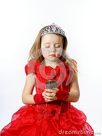 Cute little princess dressed in red isolated on white background Stock Photo