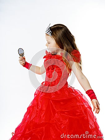 Cute little princess dressed in red on white background Stock Photo