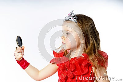 Cute little princess dressed in red on white background Stock Photo