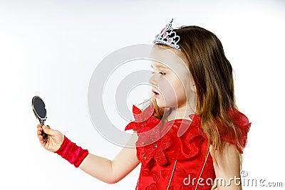 Cute little princess dressed in red on white background Stock Photo
