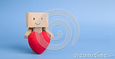 Cute little robot embracing red heart, blue panorama background Stock Photo