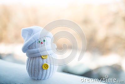 Cute little snowman on a blurry background Stock Photo