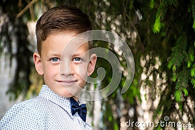 Cute little stylish boy in classic style in park Stock Photo