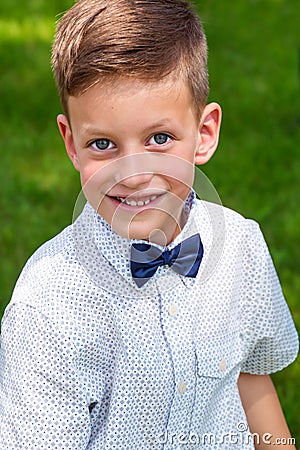 Cute little stylish boy in classic style in park Stock Photo