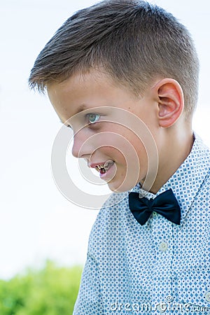 Cute little stylish boy in classic style in park Stock Photo