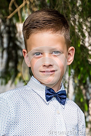 Cute little stylish boy in classic style in park Stock Photo