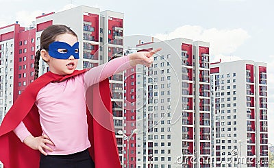 Cute little super hero girl in the red cloak Stock Photo