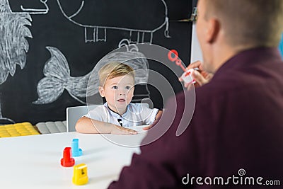 Cute little toddler boy at child therapy session. Stock Photo