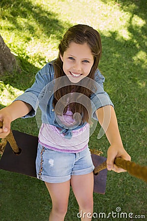 Cute little young girl on swing Stock Photo