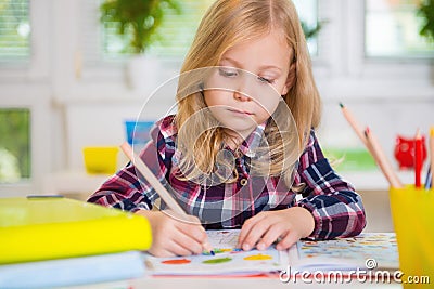 Cute lovely girl drawing at school Stock Photo
