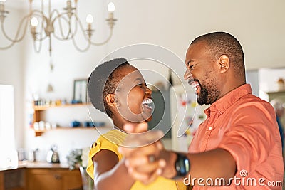 Mature happy couple dancing at home Stock Photo