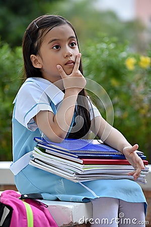 Cute Minority Child Girl Student Thinking Stock Photo