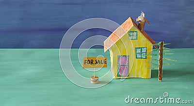 Cute model home with for sale sign. Real estate,buying house,home loan concept,copy space Stock Photo