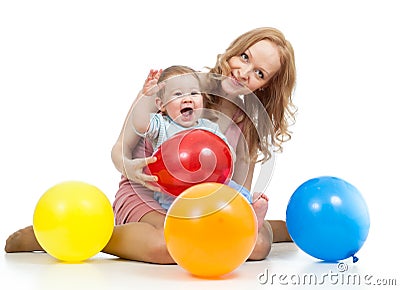 Cute mother and baby with balloons having fun Stock Photo