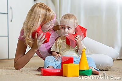 Cute mother and child boy role playing together at home Stock Photo