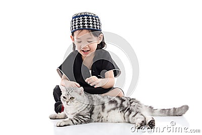 Cute muslim child playing with tabby cat Stock Photo