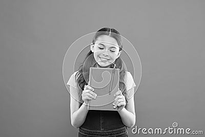 Cute nerd. Child hold book. Book store concept. Interesting literature. Development and education. Child care and happy Stock Photo