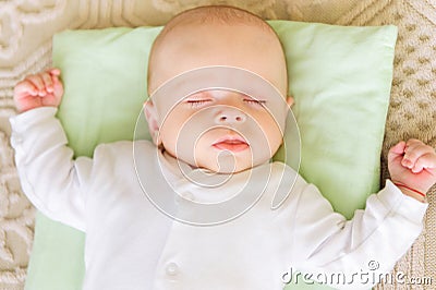 Cute newborn baby sleeping in bed Stock Photo