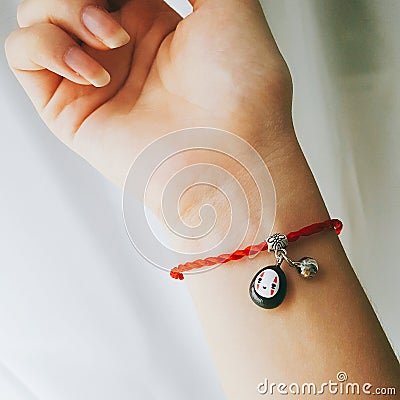 cute No-Face Spirited Away anime bracelet Stock Photo