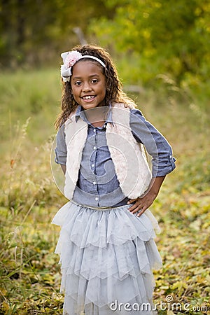 Cute outdoor portrait of a smiling African American little girl Stock Photo