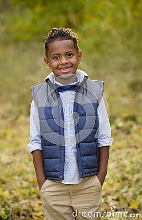 Cute outdoor portrait of a smiling African American young boy Stock Photo