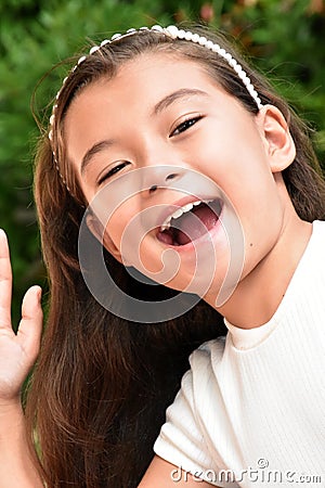 A Cute Philippina Female Laughing Closeup Stock Photo