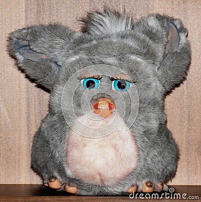 Cute plush toy. A small animal with big blue eyes Stock Photo