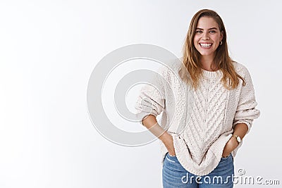 Cute positive enthusiastic charming caucasian woman casually standing white background good mood happy entertained Stock Photo