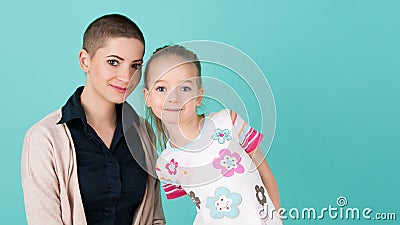 Cute preschool age girl with her mother, young cancer patient in remission. Cancer patient and family support. Stock Photo