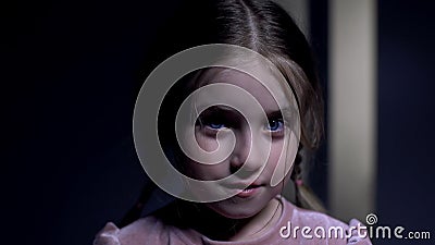 Cute pretty girl with blue eyes looking at camera and smiling, orphan profile Stock Photo